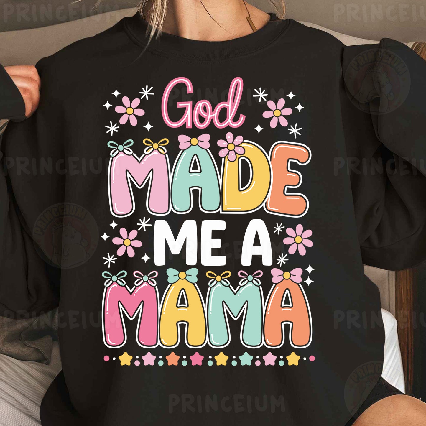a woman wearing a black sweatshirt that says god made me a mama