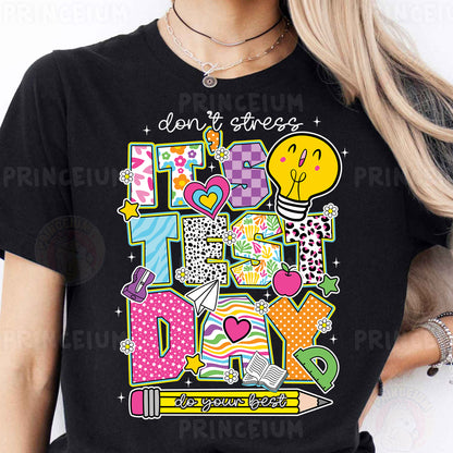 a woman wearing a black t - shirt with the words don't stress on