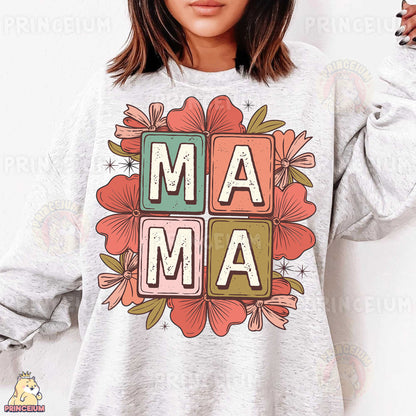 a woman wearing a sweatshirt with the word ma ma on it
