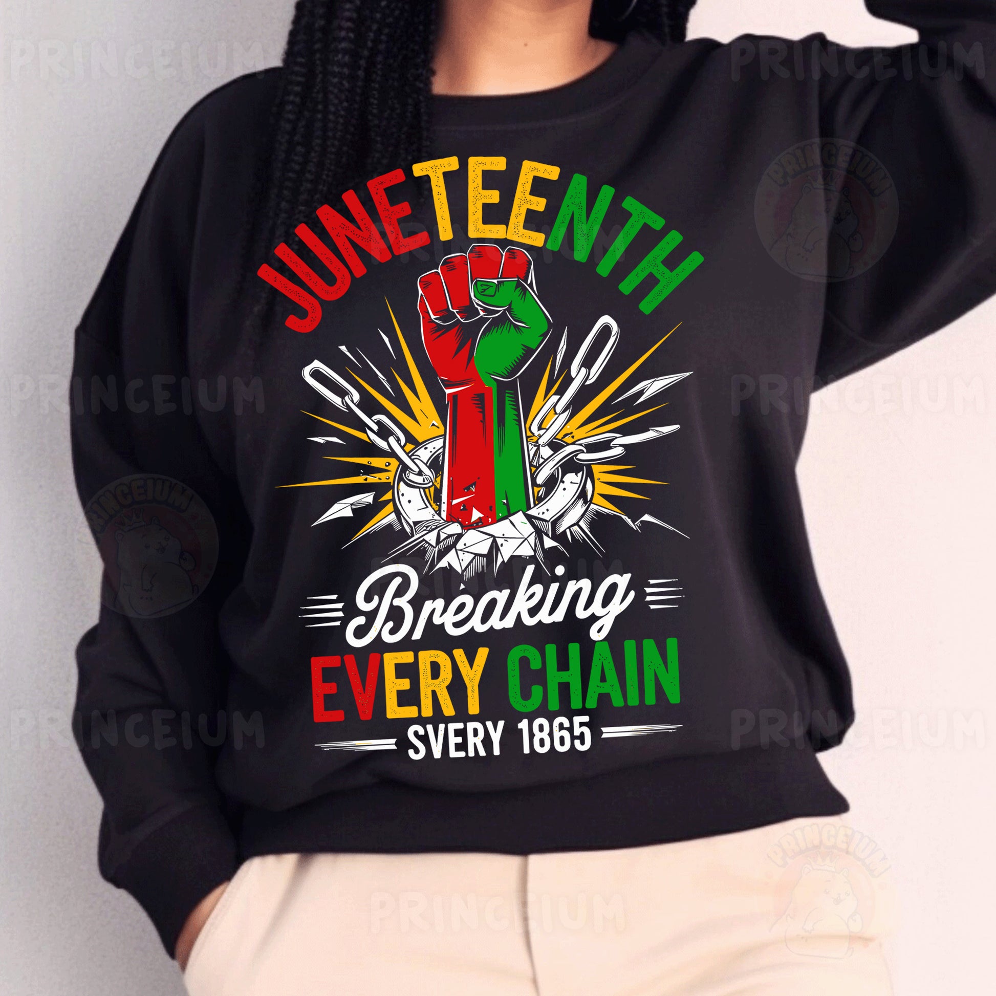 a woman wearing a black sweatshirt with a fist on it