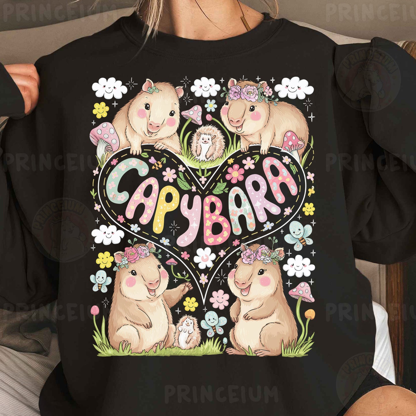 a woman wearing a black sweatshirt with a picture of two hamsters in a heart