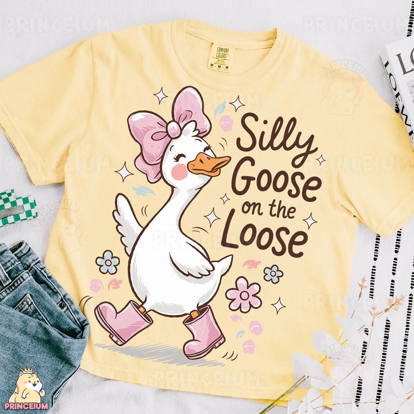 a yellow t - shirt with a cartoon duck wearing a pink bow