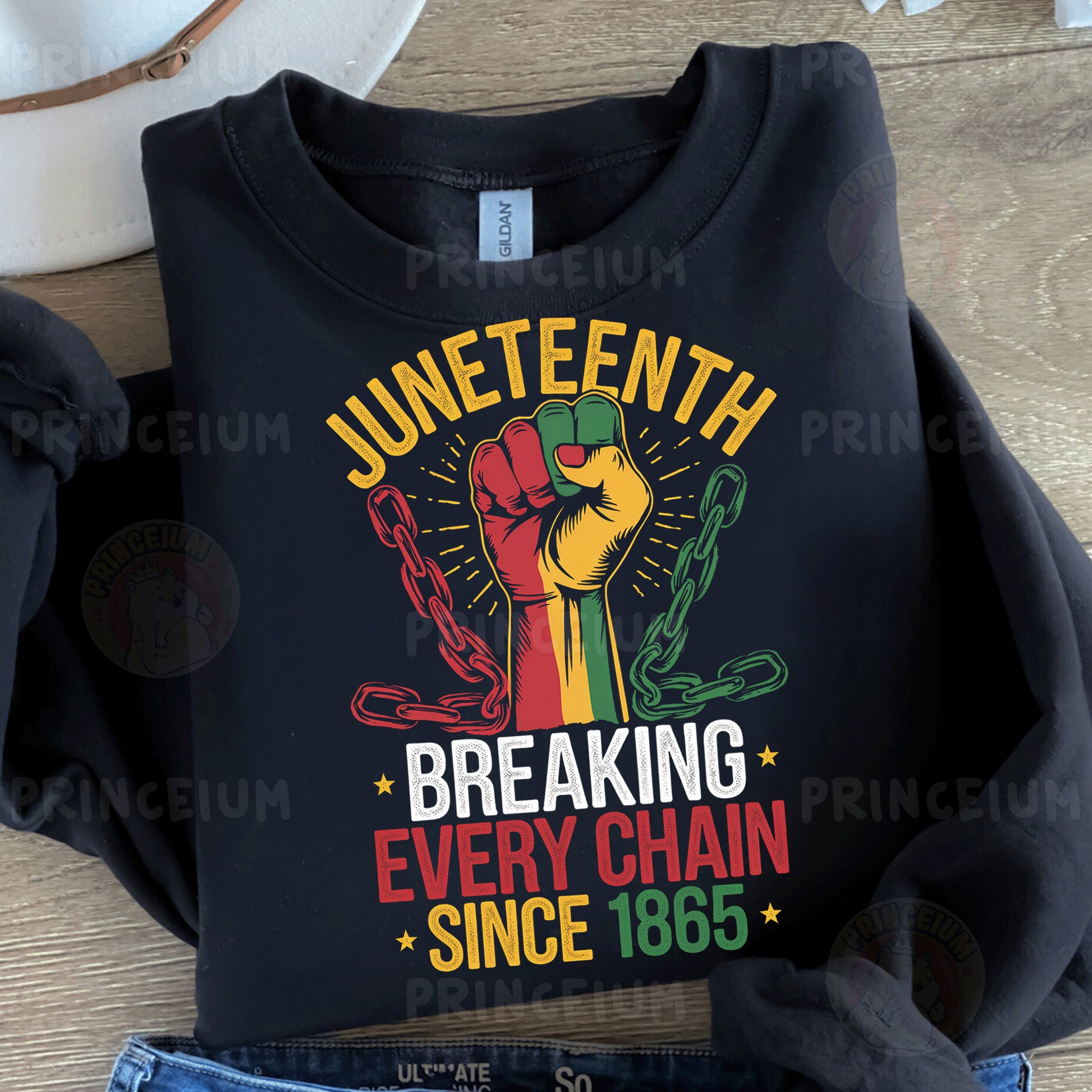a black t - shirt with the words juneteeth breaking every chain since 1876