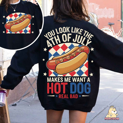 a woman wearing a sweatshirt with a hot dog on it