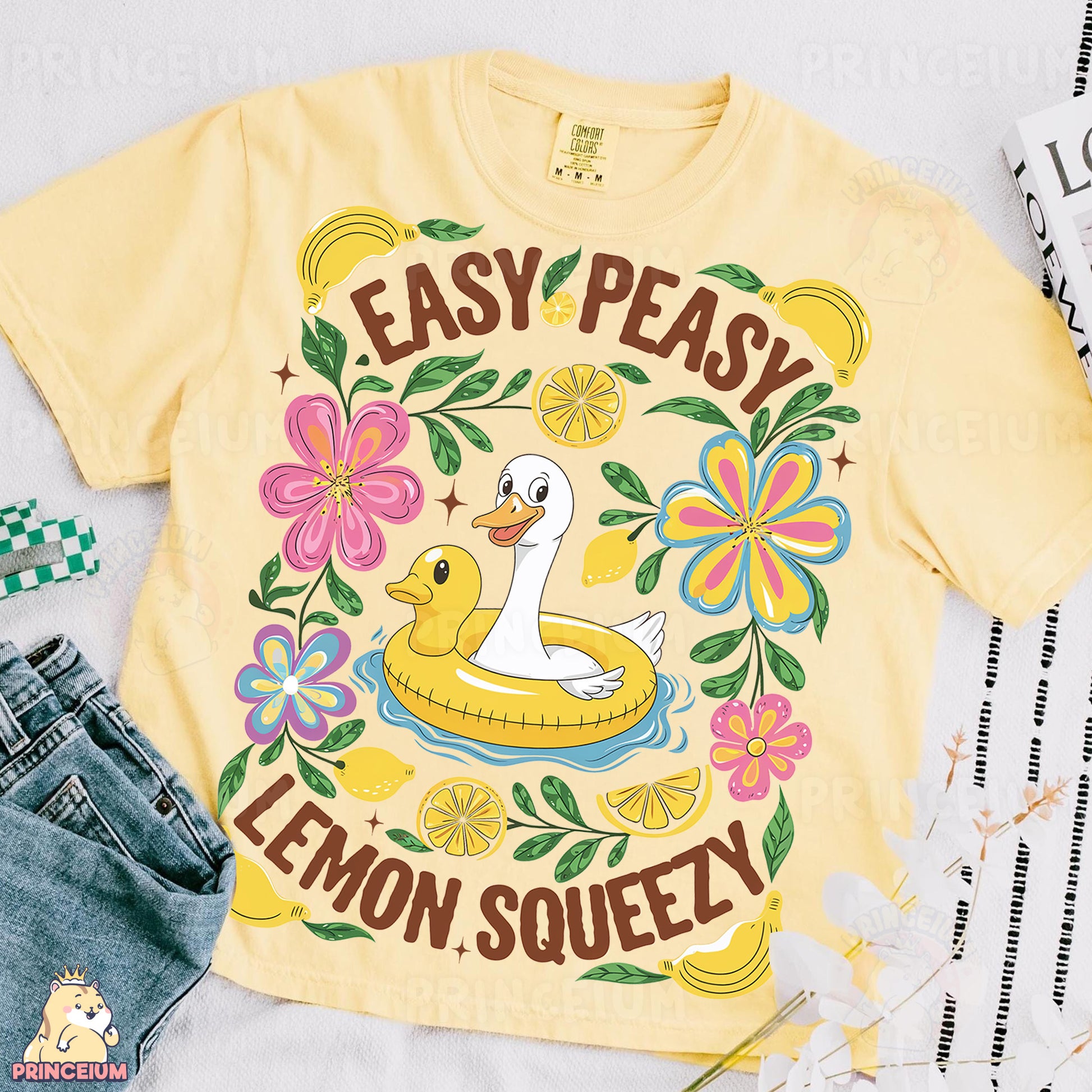 a yellow t - shirt with an image of a duck on it