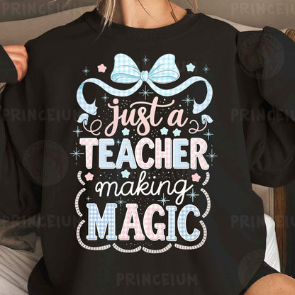 a woman wearing a black shirt that says just a teacher making magic