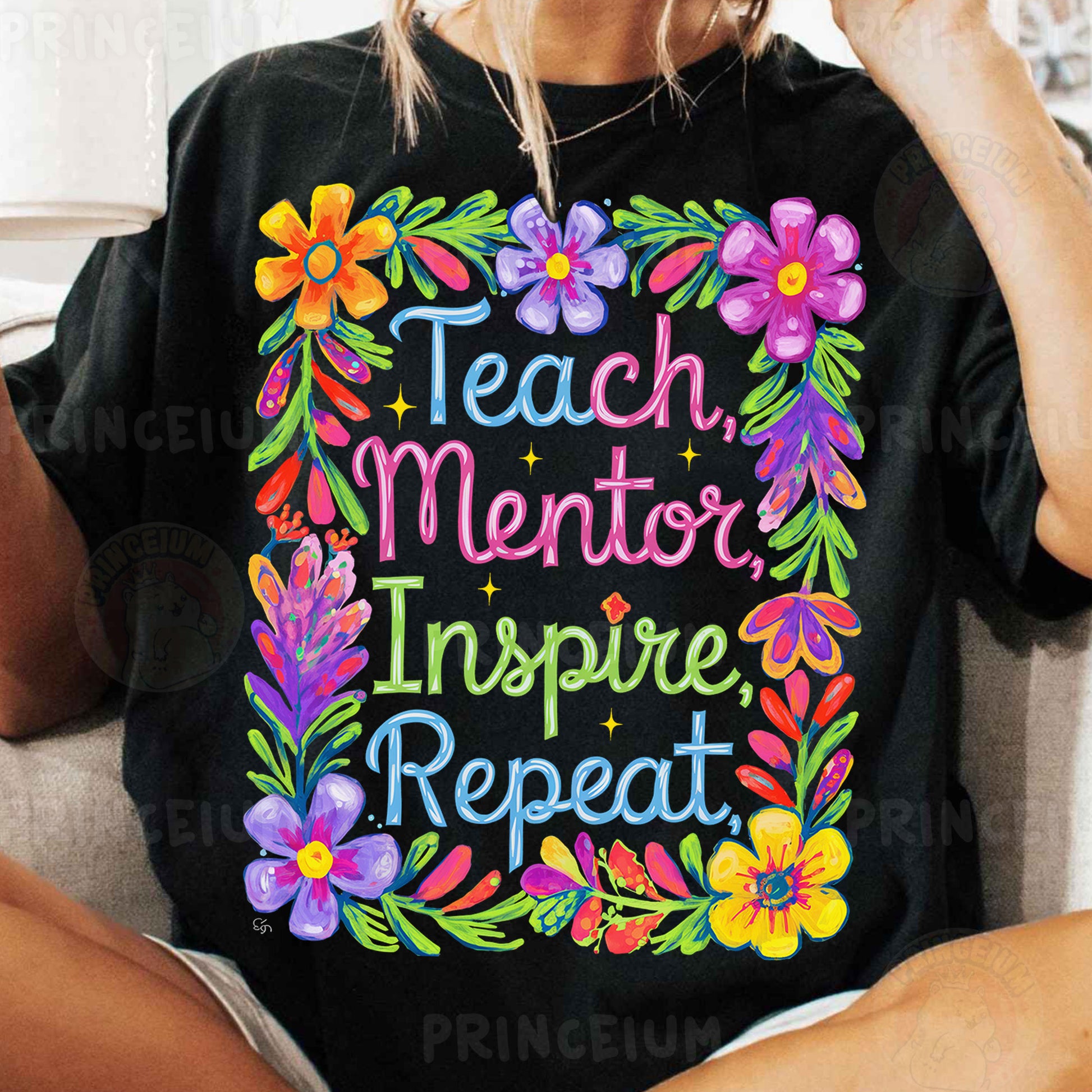 a woman sitting on a couch wearing a t - shirt that says teach mentor inspire