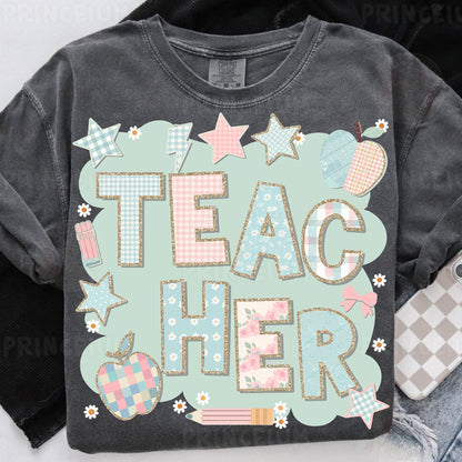 a t - shirt with the words teac her on it