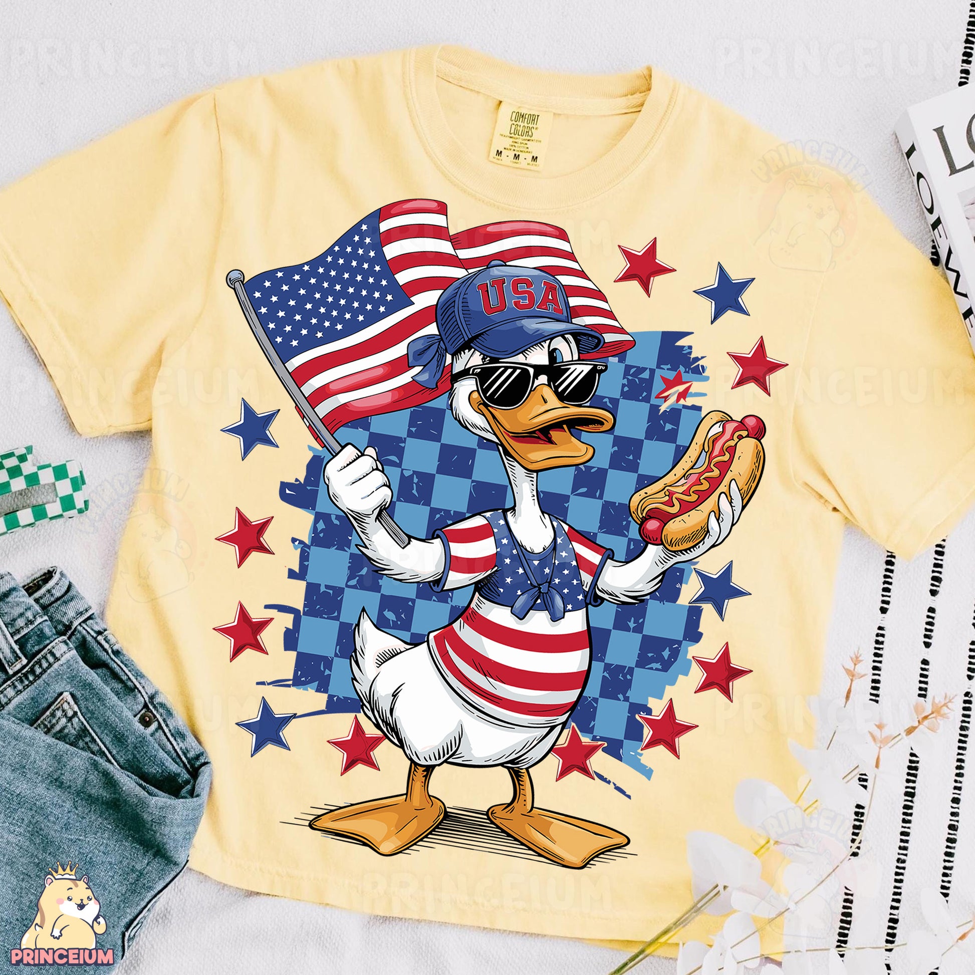 a t - shirt with a cartoon duck holding a hot dog and an american flag