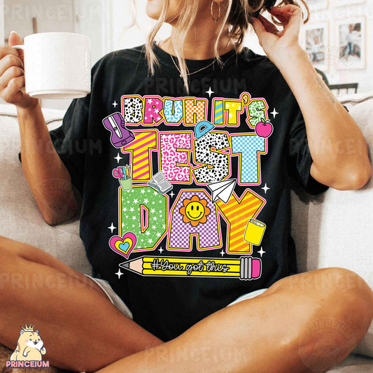 a woman sitting on a couch holding a cup of coffee