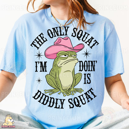 a woman wearing a blue shirt with a frog wearing a pink cowboy hat