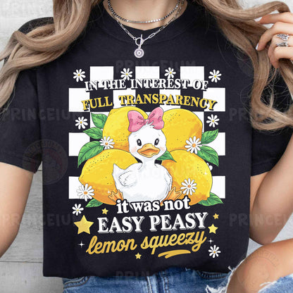 a woman wearing a black t - shirt with an image of a chicken on it