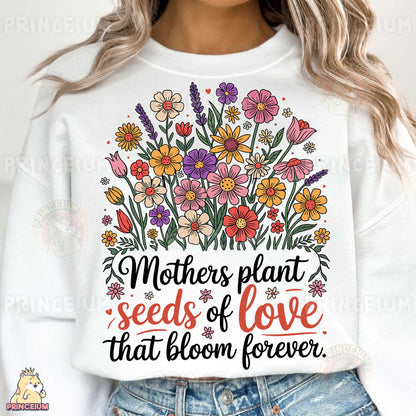 a woman wearing a white sweatshirt with flowers on it