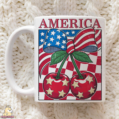 a coffee mug with a picture of cherries on it