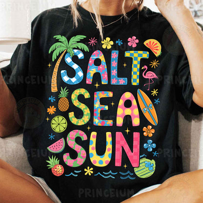 a woman sitting on a couch wearing a t - shirt that says salt sea sun