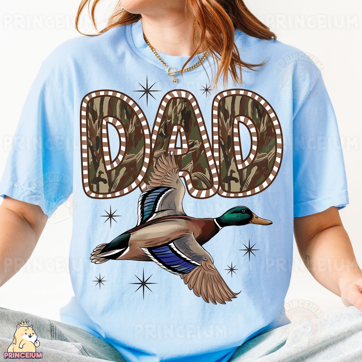 a woman wearing a blue shirt with a duck on it