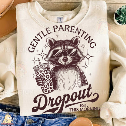 a white shirt with a raccoon holding a drink