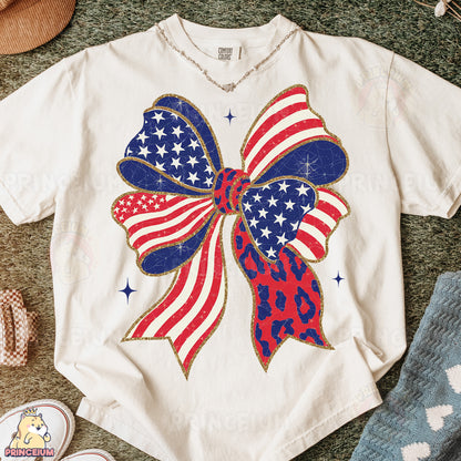 a white shirt with a red, white and blue bow on it