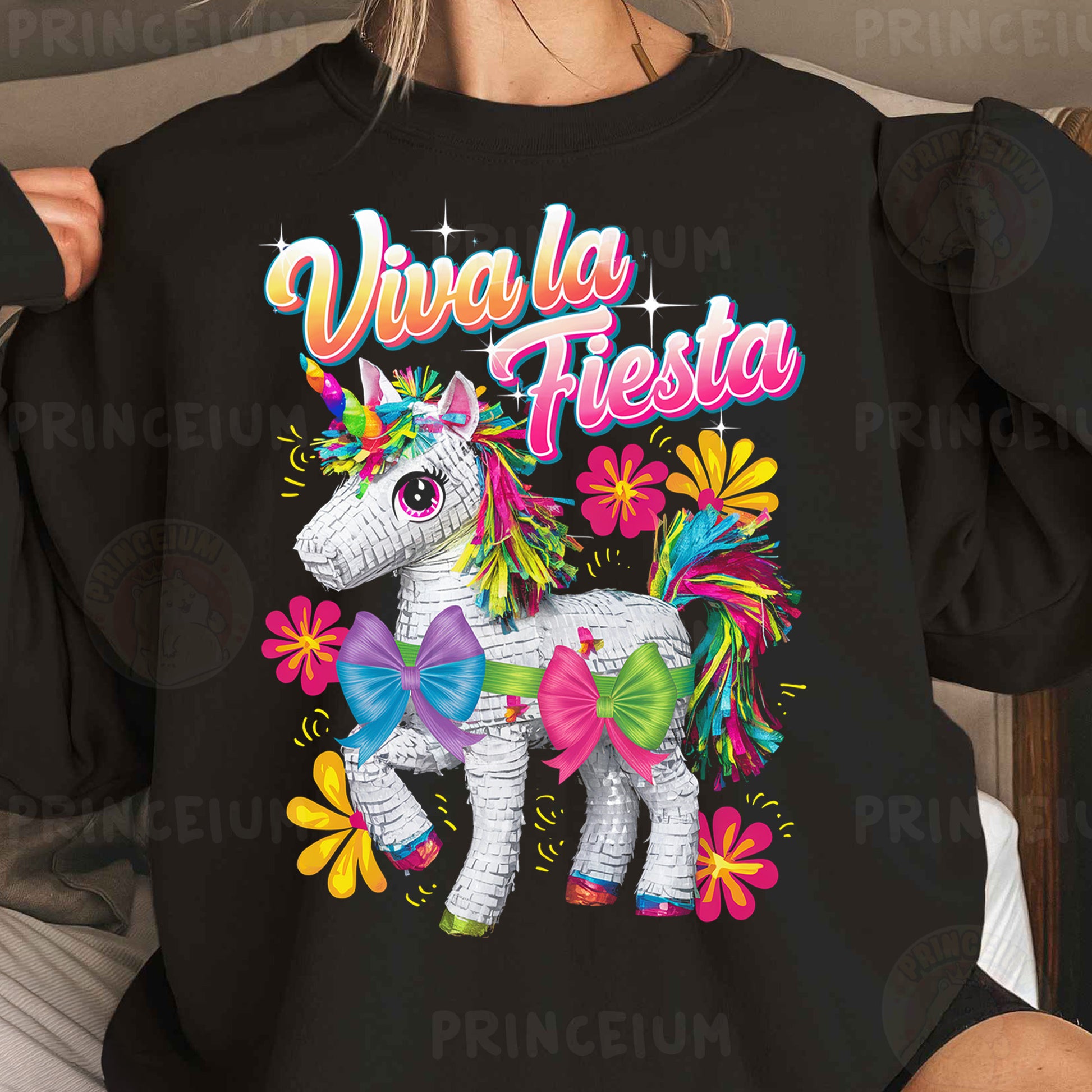 a woman wearing a black shirt with a unicorn on it