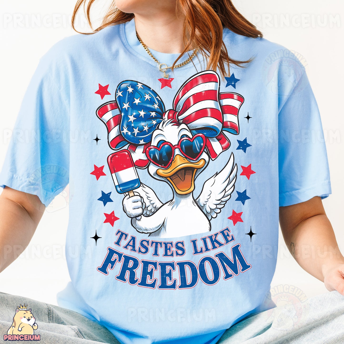 a woman wearing a blue t - shirt with a duck wearing sunglasses