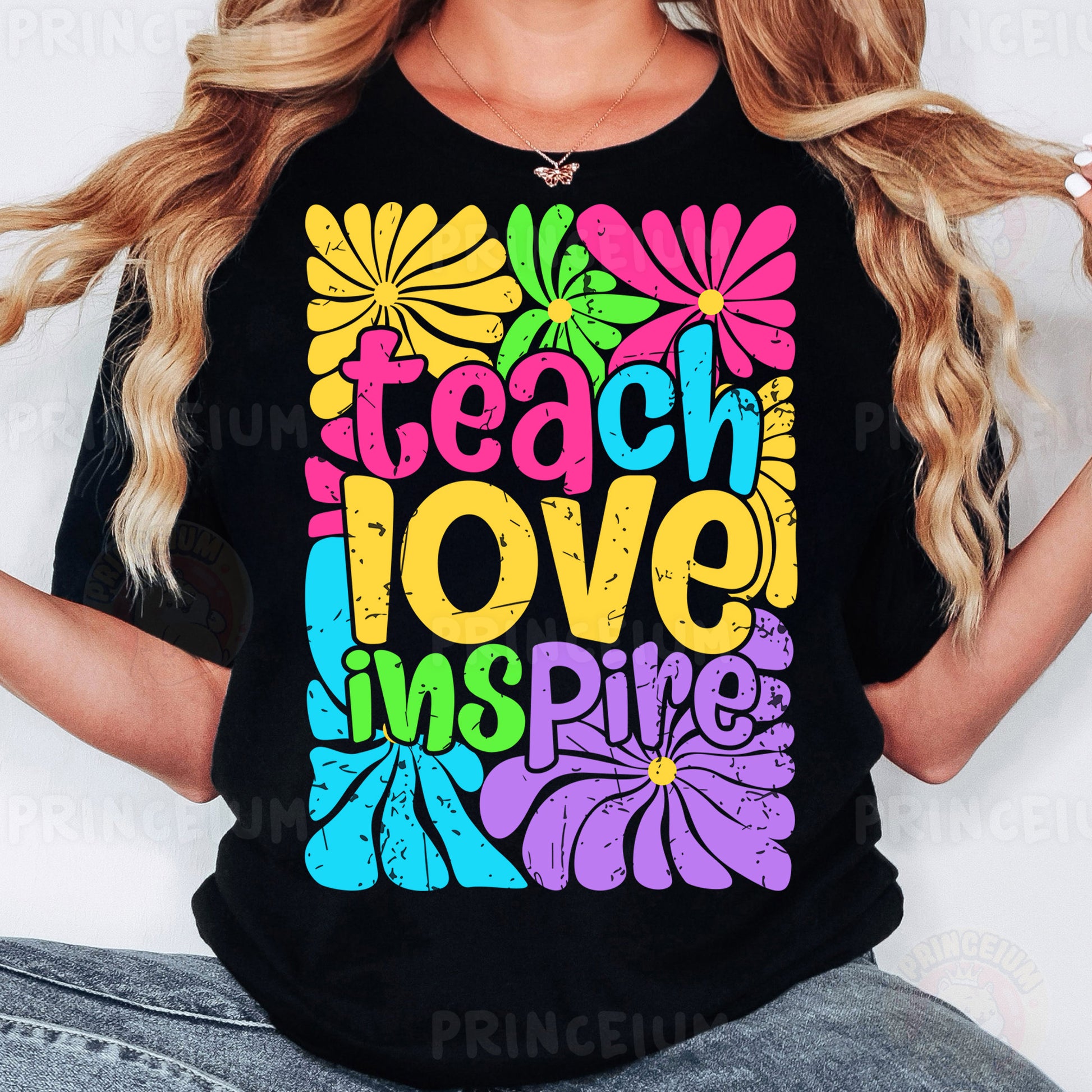 a woman wearing a black t - shirt that says teach love inspires