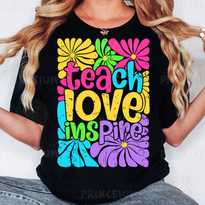 a woman wearing a black t - shirt that says teach love inspires