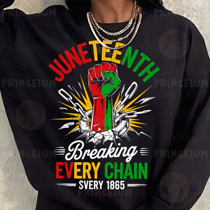 a woman wearing a black sweatshirt with a green and red fist