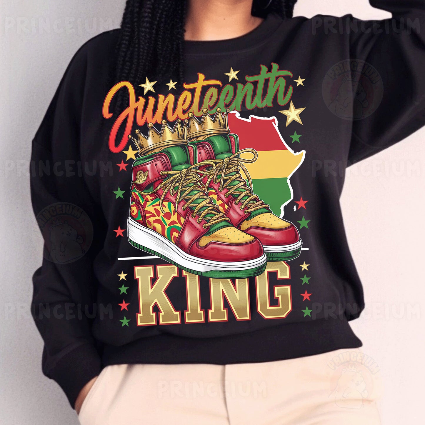 a woman wearing a black sweatshirt with a pair of sneakers on it