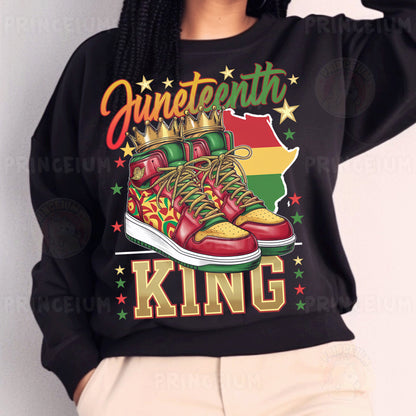 a woman wearing a black sweatshirt with a pair of sneakers on it