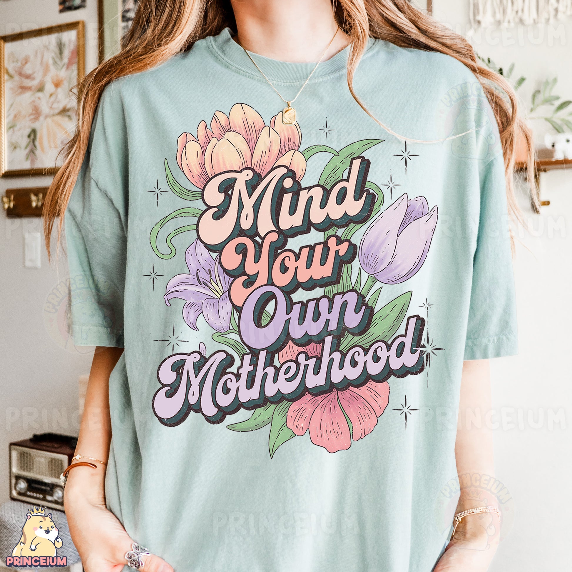 a woman wearing a t - shirt that says mind your own motherhood