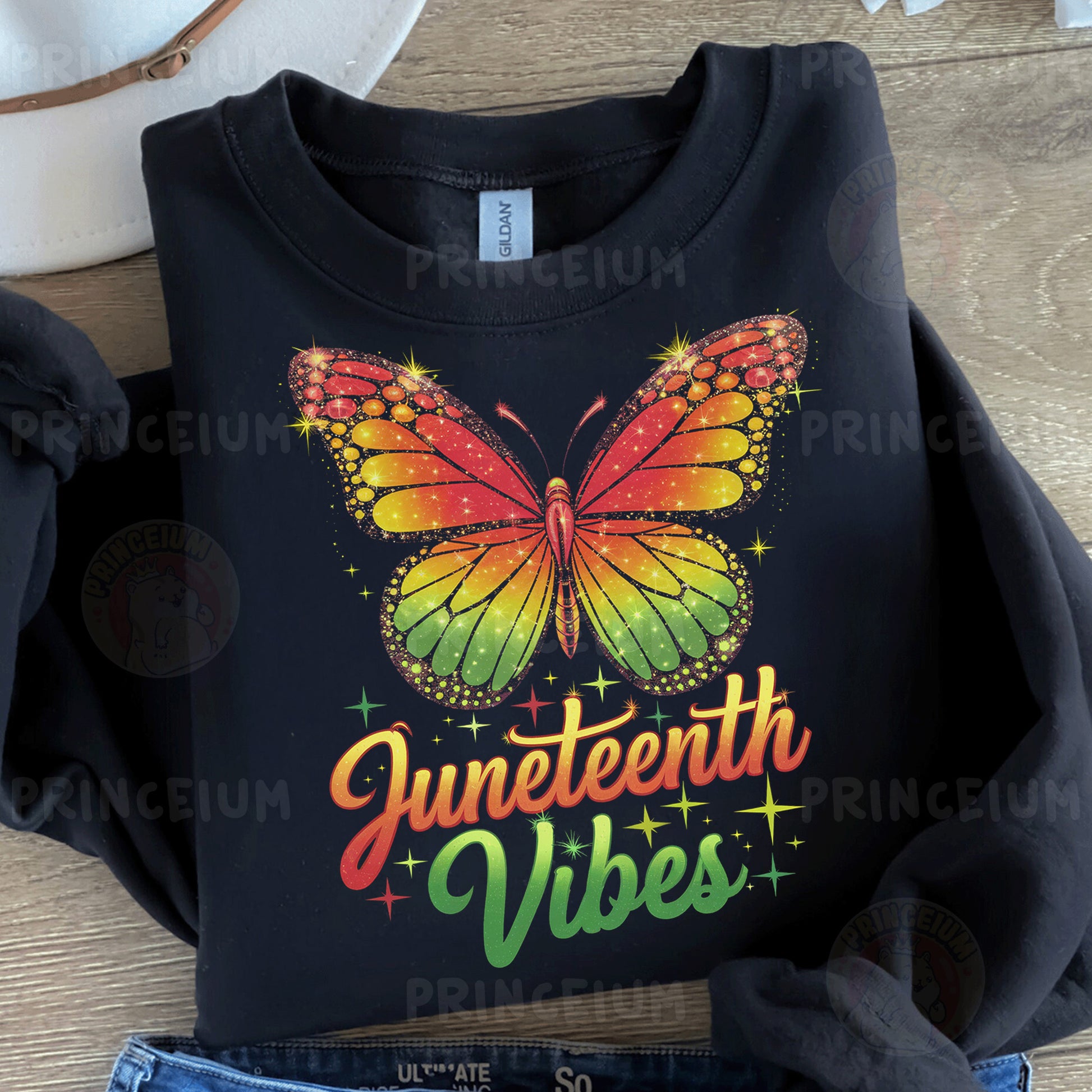a black t - shirt with a rainbow butterfly on it