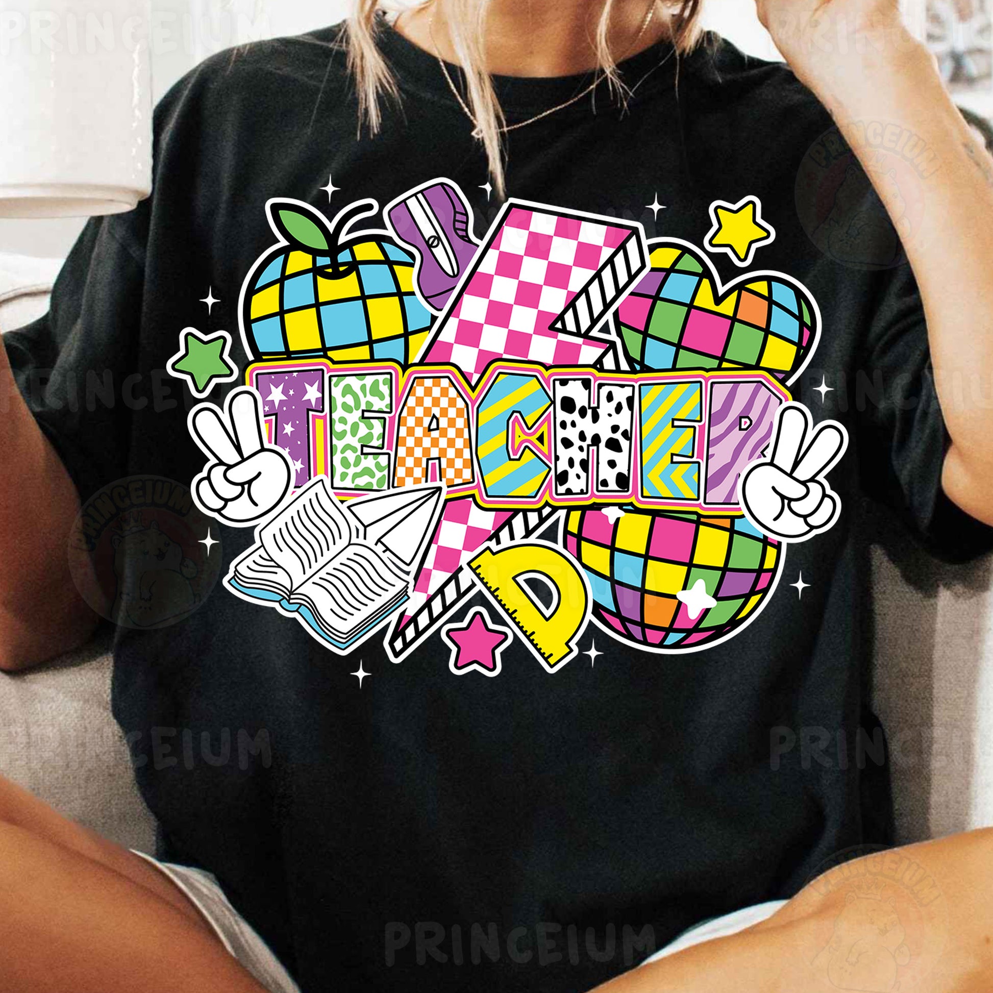 a woman sitting on a couch wearing a black shirt