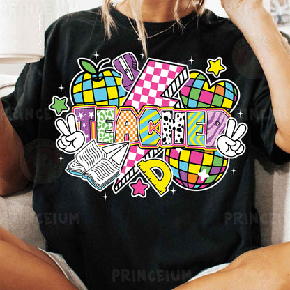 a woman sitting on a couch wearing a black shirt