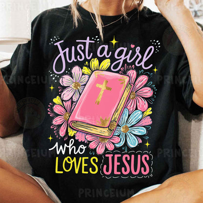 a woman sitting on a couch wearing a t - shirt that says just a girl