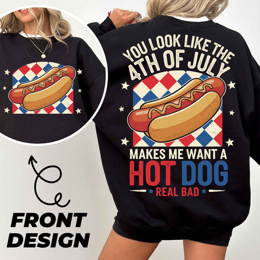a woman wearing a black sweatshirt with a hot dog on it