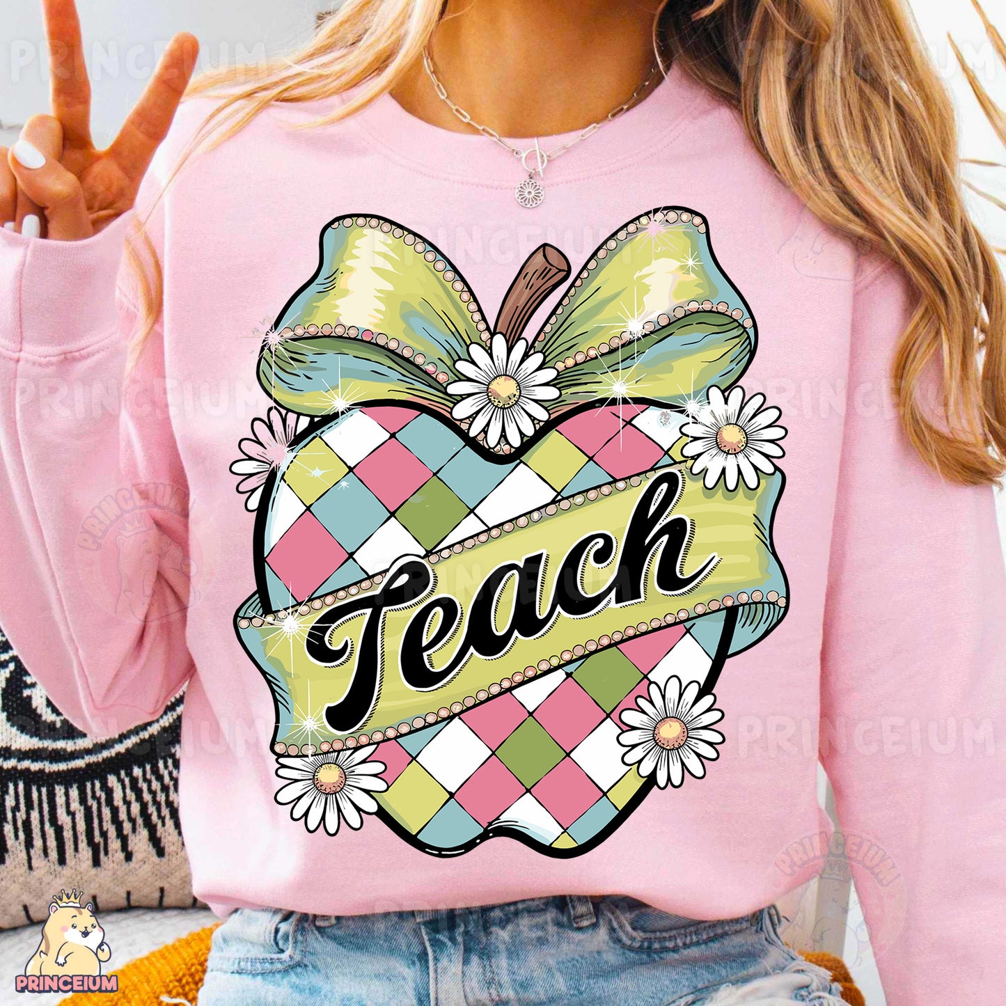 a woman wearing a pink sweater with a peace sign on it