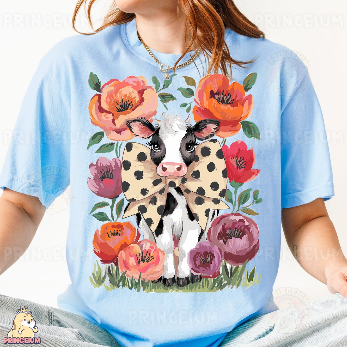 a woman wearing a t - shirt with a cow on it