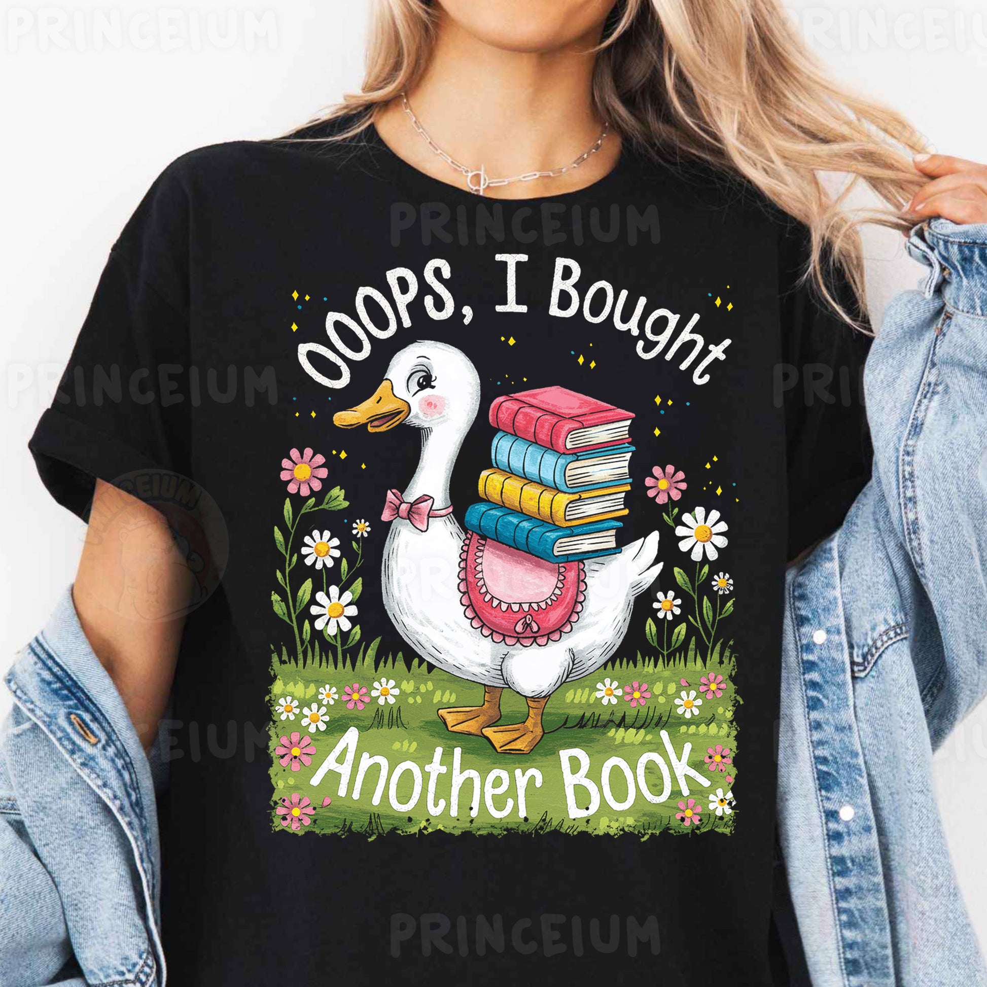 a woman wearing a black shirt with a goose reading books