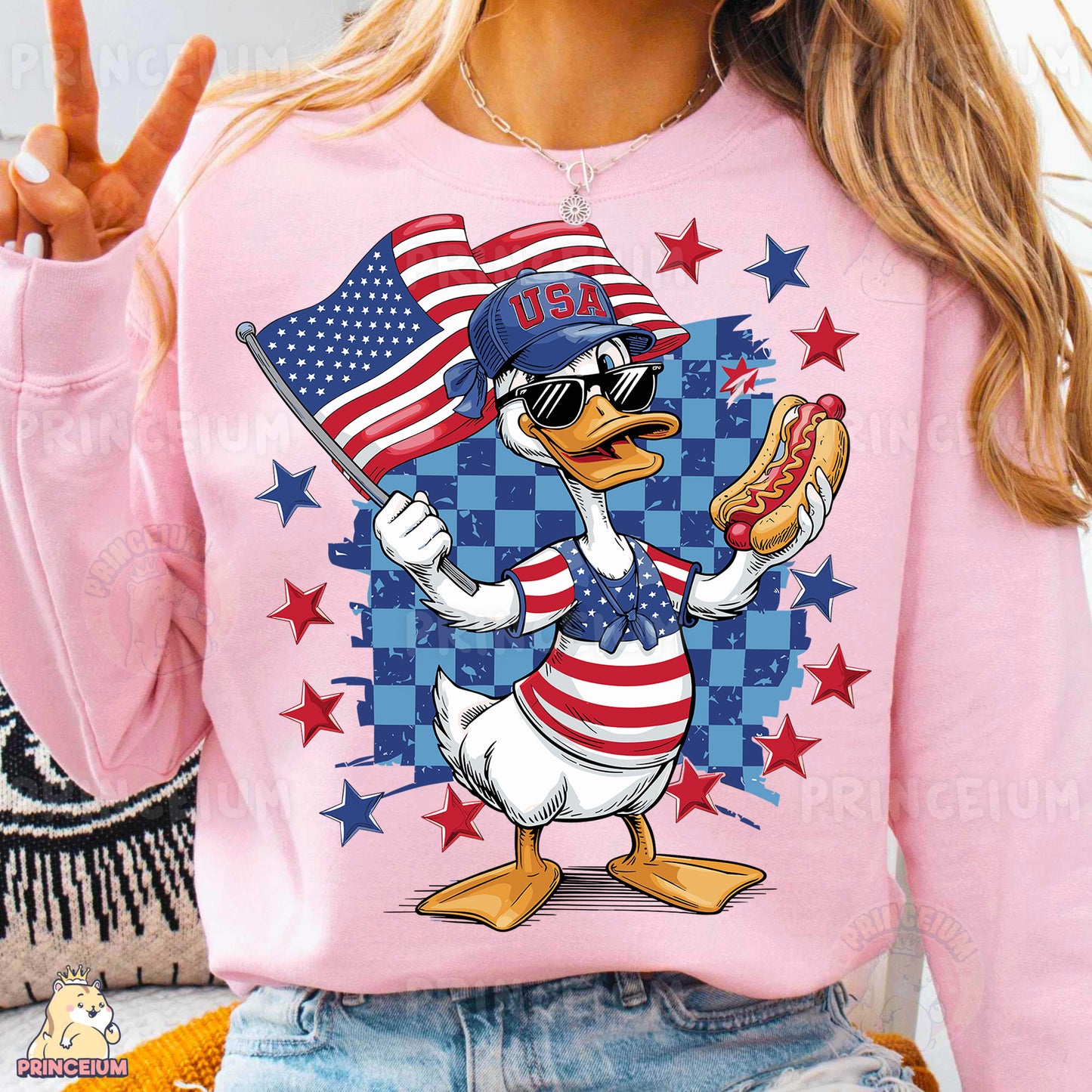 a woman wearing a pink shirt with a duck holding a hot dog and an american