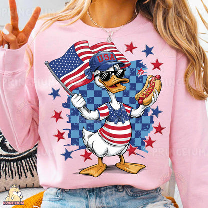 a woman wearing a pink shirt with a duck holding a hot dog and an american