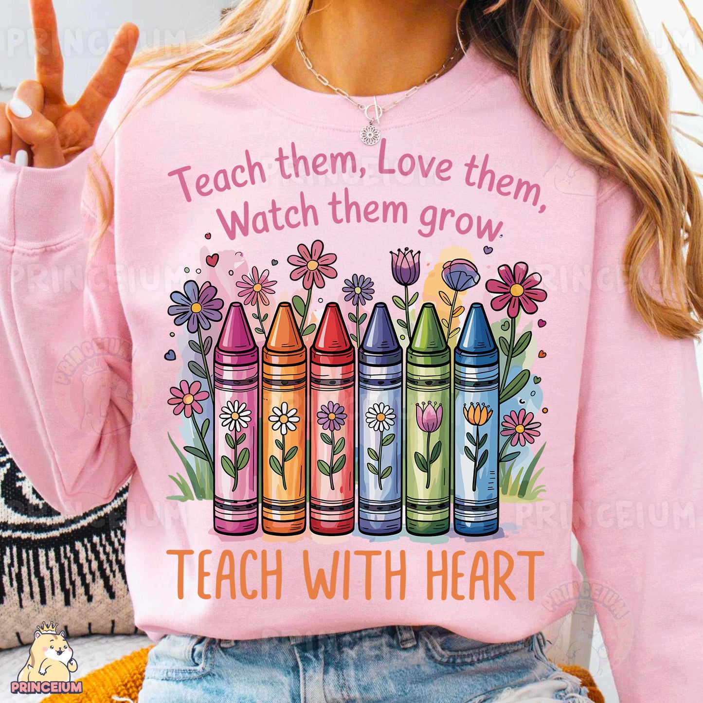 a woman wearing a pink shirt that says teach them, love them, watch them