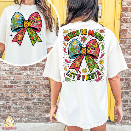 a woman wearing a white shirt with a colorful bow on it
