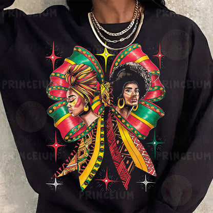 a woman wearing a black shirt with a picture of two women on it