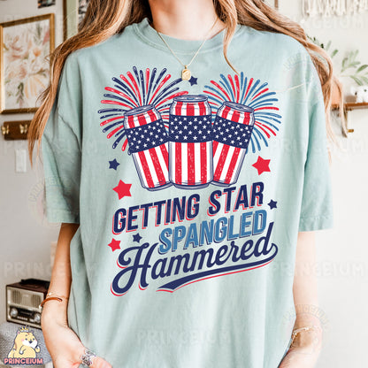 a woman wearing a t - shirt that says getting star spangled hammered