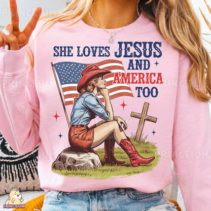 a woman wearing a pink shirt with a picture of a girl sitting on a cross