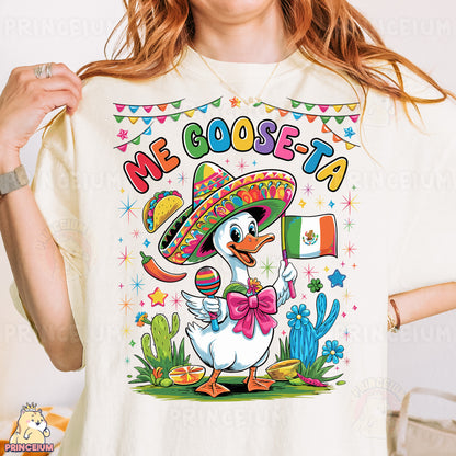 a woman wearing a t - shirt with a cartoon duck wearing a sombrero