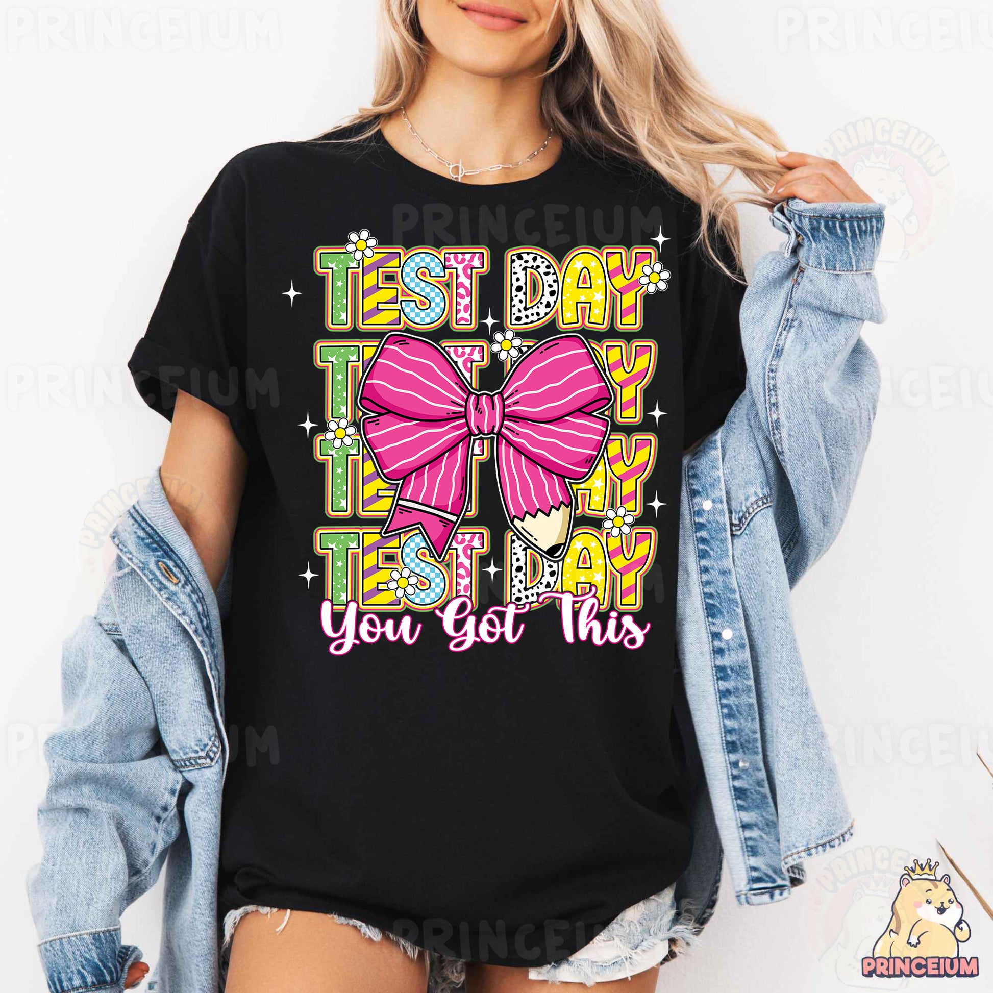a woman wearing a black tshirt with a pink bow on it