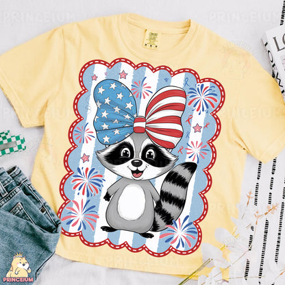 a t - shirt with a raccoon wearing an american flag bow