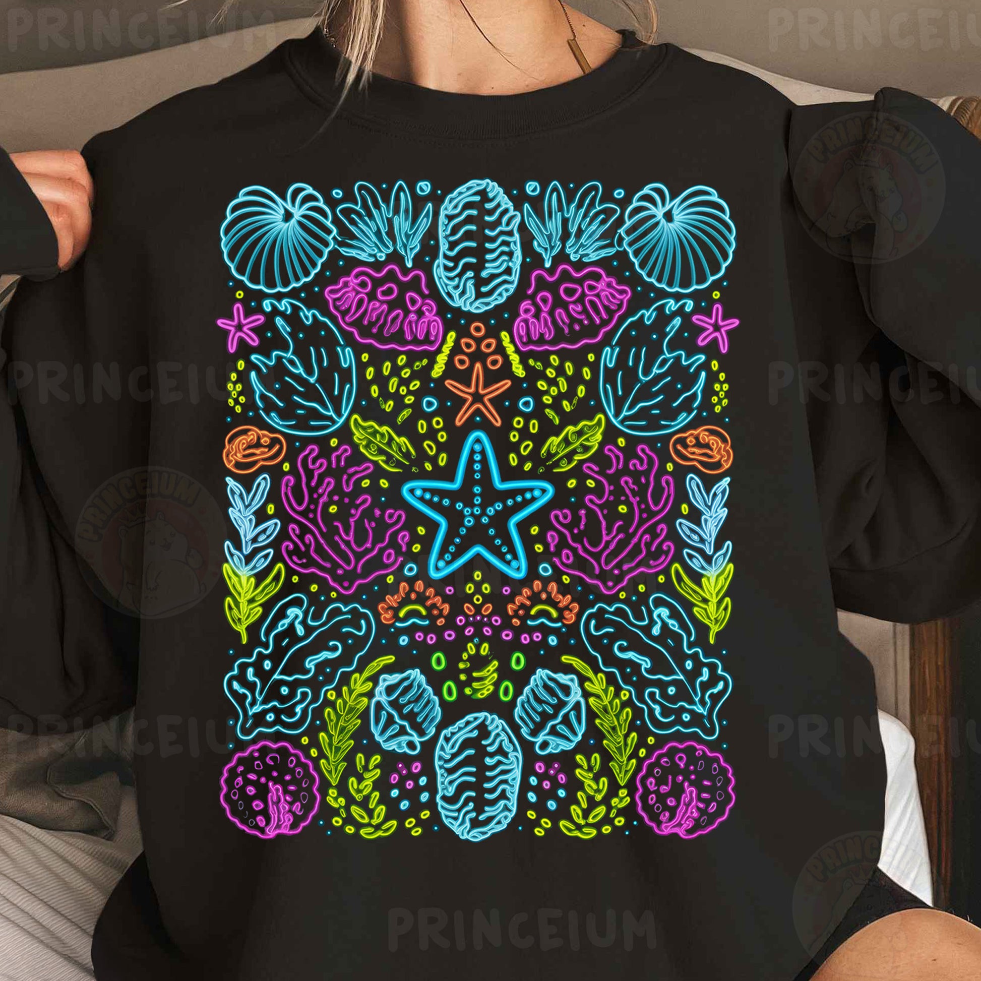 a woman wearing a black sweatshirt with a colorful design on it