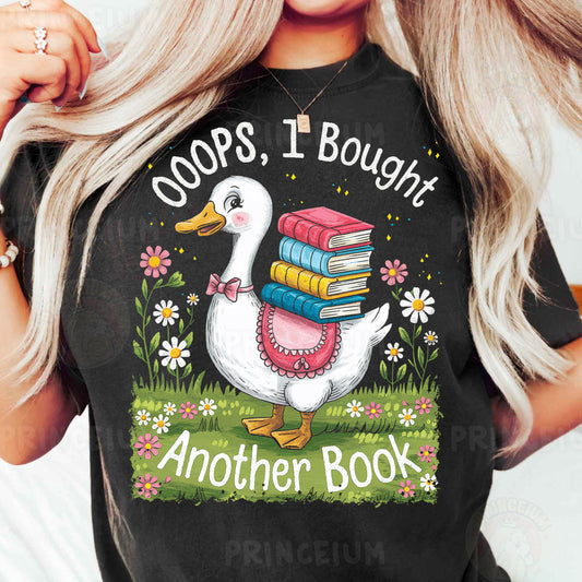 a woman wearing a black t - shirt with a goose holding a stack of books